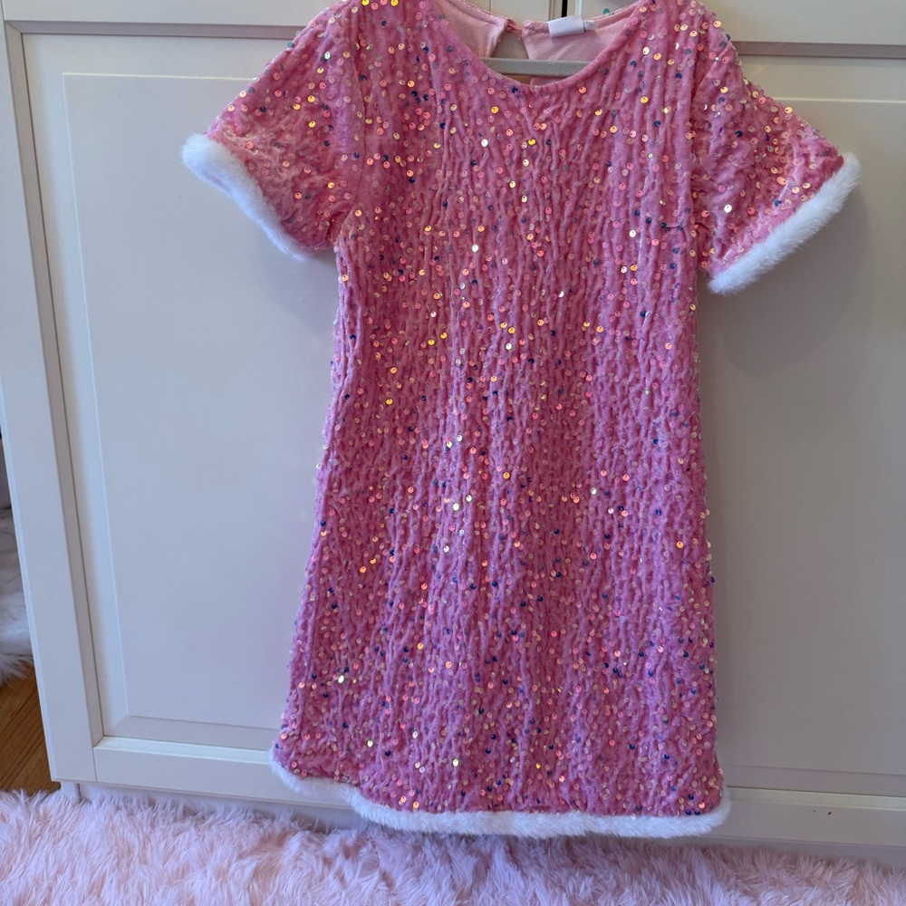 Brand new sequin dress with faux fur sleeve and bottom